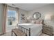 Bright bedroom with a wrought iron bed frame, natural light, and soft colors at 2505 Brescia St., Myrtle Beach, SC 29579