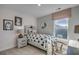 Cozy bedroom features a twin bed with star patterned bedding, neutral walls, and a cute decorative window shade at 52505 Brescia St., Myrtle Beach, SC 29579