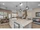 Bright, open kitchen with a large island, breakfast bar seating, and a seamless transition to the living spaces at 2505 Brescia St., Myrtle Beach, SC 29579