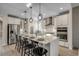 Elegant white kitchen with a large island, stainless steel appliances, and pendant lighting for a modern touch at 2505 Brescia St., Myrtle Beach, SC 29579