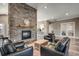 Inviting lounge area with a stone fireplace, comfortable leather seating, and stylish decor at 2505 Brescia St., Myrtle Beach, SC 29579