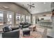 Open concept lounge features a stone fireplace, comfortable leather seating, and vaulted ceilings at 2505 Brescia St., Myrtle Beach, SC 29579