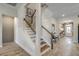 Open staircase with white risers, wood treads, and decorative railing leading to the upper level at 2505 Brescia St., Myrtle Beach, SC 29579