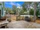 Open backyard area with a metal bench and wooden fence at 5520 N Kings Hwy., Myrtle Beach, SC 29577