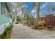 Spacious backyard and patio area features mature trees, a firepit and seating at 5520 N Kings Hwy., Myrtle Beach, SC 29577