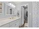 Clean and bright bathroom with a vanity, mirror, and an open doorway to the toilet room at 5520 N Kings Hwy., Myrtle Beach, SC 29577