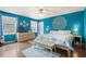 Vibrant bedroom with a mandala wall design, creating a peaceful and stylish retreat at 5520 N Kings Hwy., Myrtle Beach, SC 29577