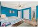 Bright bedroom with a ceiling fan, closet and adjacent bathroom, creating a comfortable and private space at 5520 N Kings Hwy., Myrtle Beach, SC 29577