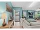 Cozy living room features stylish decor, a fireplace, and an open doorway to the outdoor space at 5520 N Kings Hwy., Myrtle Beach, SC 29577
