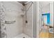Modern tiled shower with a rainfall showerhead, offering a spa-like experience at 5520 N Kings Hwy., Myrtle Beach, SC 29577