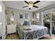 Comfortable bedroom featuring a ceiling fan, a balcony, and beachy themed decorations at 5905 South Kings Hwy. # 4309, Myrtle Beach, SC 29575