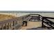 Serene boardwalk with benches overlooking the beach and ocean, ideal for a peaceful stroll at 5905 South Kings Hwy. # 4309, Myrtle Beach, SC 29575