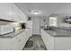 Functional kitchen with white cabinetry, stainless steel appliances, and open layout, perfect for everyday meal preparation at 5905 South Kings Hwy. # 4309, Myrtle Beach, SC 29575
