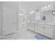 Well-lit bathroom with double sinks, modern fixtures, and a glass-enclosed shower at 611 Cattle Drive Circle, Myrtle Beach, SC 29588