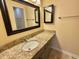 Bathroom featuring a vanity with granite countertop, modern sink, and framed mirrors at 635 Waterway Village Blvd. # 12-I, Myrtle Beach, SC 29579