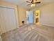 Cozy bedroom with carpet, ceiling fan and ensuite bathroom access, featuring a spacious closet at 635 Waterway Village Blvd. # 12-I, Myrtle Beach, SC 29579