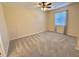 Bright bedroom featuring a ceiling fan, neutral carpet, and a window with curtains at 635 Waterway Village Blvd. # 12-I, Myrtle Beach, SC 29579