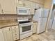 Bright kitchen features updated appliances, granite countertops, and plenty of storage at 635 Waterway Village Blvd. # 12-I, Myrtle Beach, SC 29579
