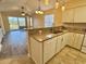 Well-equipped kitchen with granite countertops, modern appliances, and breakfast bar overlooking living area at 635 Waterway Village Blvd. # 12-I, Myrtle Beach, SC 29579