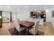 Inviting dining area with an open view of the kitchen and lots of light at 6614 Torino Lane, Myrtle Beach, SC 29572