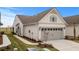 Charming home exterior with a two-car garage, neutral siding, and manicured lawn at 6614 Torino Lane, Myrtle Beach, SC 29572