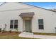 Inviting front entrance with a covered porch, well-kept lawn, and pleasant curb appeal at 6614 Torino Lane, Myrtle Beach, SC 29572