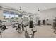 Well-equipped gym with cardio and weight machines, plus large windows overlooking the community at 6614 Torino Lane, Myrtle Beach, SC 29572