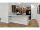 Modern kitchen featuring stainless steel appliances, dark cabinetry and granite countertops at 6614 Torino Lane, Myrtle Beach, SC 29572