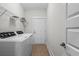 Well-equipped laundry room with shelving and appliances at 6614 Torino Lane, Myrtle Beach, SC 29572