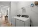 Functional laundry area with washer, dryer and shelving at 6614 Torino Lane, Myrtle Beach, SC 29572