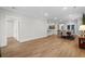 Spacious living area featuring hardwood floors and access to dining area at 6614 Torino Lane, Myrtle Beach, SC 29572