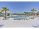 Stunning community pool featuring in-pool loungers and a covered seating area at 6614 Torino Lane, Myrtle Beach, SC 29572