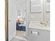 Bathroom featuring a sink with gold fixtures, a toilet, and an open doorway to the bedroom at 679 Riverwalk Dr. # 302, Myrtle Beach, SC 29579