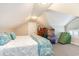 Attic bedroom featuring a queen bed, carpeted floors, and a storage area under the eaves at 78 Oakmont Dr., Pawleys Island, SC 29585