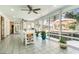 Bright sun room with tile flooring, a ceiling fan, and views of the backyard at 78 Oakmont Dr., Pawleys Island, SC 29585