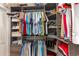 Organized walk-in closet with custom shelves, hanging rods, and drawers for clothes and accessories at 78 Oakmont Dr., Pawleys Island, SC 29585