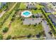 Aerial view showcasing the community pool and clubhouse, surrounded by well-maintained landscaping at 801 San Marco Ct. # C, Myrtle Beach, SC 29579