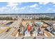 Aerial view of townhomes highlighting the community's convenient location near a pond and community pool at 801 San Marco Ct. # C, Myrtle Beach, SC 29579