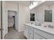 Bathroom featuring a double-sink vanity, tile floor, and a shower-tub combination, along with a view to a walk-in closet at 801 San Marco Ct. # C, Myrtle Beach, SC 29579