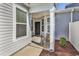 Inviting front porch with seating and a well-lit entryway at 801 San Marco Ct. # C, Myrtle Beach, SC 29579