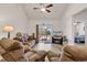 Inviting living room with comfortable seating, ceiling fan, and sliding glass doors to the outdoor space at 801 San Marco Ct. # C, Myrtle Beach, SC 29579