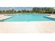 Inviting community pool featuring a 4 FT depth marker, surrounded by lounge chairs and lush landscaping at 801 San Marco Ct. # C, Myrtle Beach, SC 29579