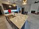 Large kitchen with granite island, dark cabinets, stainless appliances and an open floor plan at 8012 Old Reaves Ferry Rd., Conway, SC 29526