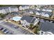 Aerial view of neighborhood featuring pool, pond and convenient parking at 805 Sunswept Ct. # 102, Murrells Inlet, SC 29576