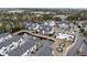 Aerial view showcasing pond, pool, and condo exteriors at 805 Sunswept Ct. # 102, Murrells Inlet, SC 29576