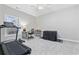 Bonus room includes exercise equipment, desk, and a ceiling fan at 805 Sunswept Ct. # 102, Murrells Inlet, SC 29576