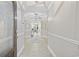 Elegant foyer with tray ceiling, decorative lighting, and neutral tile flooring at 805 Sunswept Ct. # 102, Murrells Inlet, SC 29576