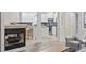 Modern kitchen with white cabinetry, stainless appliances, and tile backsplash, open to the living space at 805 Sunswept Ct. # 102, Murrells Inlet, SC 29576