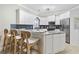 Charming kitchen with granite countertops, stainless steel appliances, and white cabinetry offering a modern touch at 805 Sunswept Ct. # 102, Murrells Inlet, SC 29576
