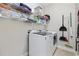 Laundry room featuring washer, dryer, shelving, and cleaning equipment at 805 Sunswept Ct. # 102, Murrells Inlet, SC 29576